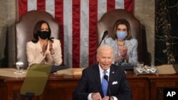 President Joe Biden speaks to a joint session of Congress, April 28, 2021, as Vice President Kamala Harris and House Speaker Nancy Pelosi watch.