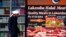 A man walks past a shop selling 'Halal meat' in the western Sydney suburb of Lakemba, September 25, 2014. 