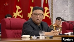 North Korean Leader Kim Jong Un speaks at plenary meeting of 8th central committee of the Workers' Party of Korea in this still image taken from KRT footage on June 16, 2021.