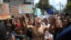 FILE - Indigenous demonstrators join a protest outside the Brazilian Embassy to call on Brazil's President Jair Bolsonaro to act to protect the Amazon rainforest, in Bogota, Colombia, Aug. 23, 2019.