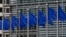 FILE - European Union flags are seen outside the European Commission headquarters in Brussels, Sept. 10, 2014. 