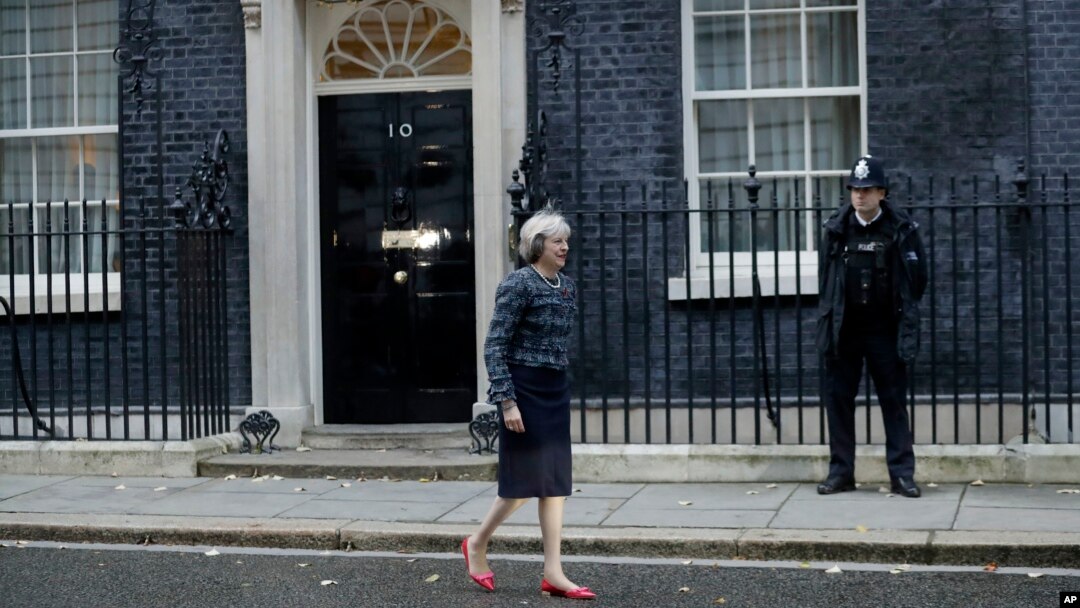 FILE - British Prime Minister Theresa May is seen walking outside 10 Downing Street in London, Nov. 9, 2016. 