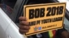Zanu PF youth carry placards showing their support for President Mugabe, who is expected to contest the 2018 presidential poll.