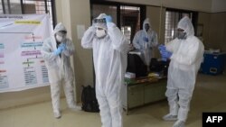 Medical staff wear Personal Protection Equipment (PPE) during a Covid-19 Coronavirus screening at the dedicated COVID facility of the civil hospital, in Nashik, on Sept. 13, 2020.