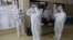 Medical staff wear Personal Protection Equipment (PPE) during a Covid-19 Coronavirus screening at the dedicated COVID facility of the civil hospital, in Nashik, on Sept. 13, 2020.