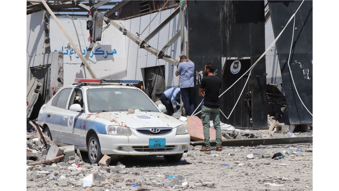 FILE - The morning after airstrikes hit a detention center holding migrants killed more than 50 people and injured at least 130, blood still stains the rubble as officials search for human remains, in Tripoli, Libya, July 3, 2019. (H. Murdock/VOA)