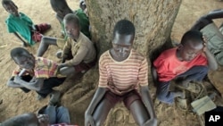 Children suffering from nodding disease gather in Akoya-Lamin Omony village in Gulu district, 384 kilometers north of Uganda's capital of Kampala, February 19, 2012.