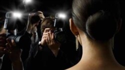 Photographers are taking a picture of a film star