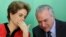 FILE - Brazil's President Dilma Rousseff (L) talks to Vice President Michel Temer at the Planalto Palace in Brasilia, Brazil, March 2, 2016.