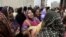 Pakistani women mourn the death of a relative killed from a fire in a factory in Karachi, Pakistan, September 13, 2012. 