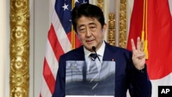 Japan's Prime Minister Shinzo Abe delivers his keynote speech on Japan's economy and investment-friendly reforms, at the New York Stock Exchange, Sept. 20, 2017.