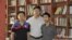FILE - Beijing lawyer Zhang Kai is pictured with Wu Liangjie (L) and Deng Jiyuan (R), who are not otherwise identified in this courtesy image.