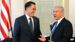 FILE - Israel's Prime Minister Benjamin Netanyahu with Mitt Romney, in Jerusalem, July 29, 2012.