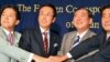 Four of the candidates for the presidency of the Liberal Democratic Party join hands for a photograph. (Steve Herman/VOA)