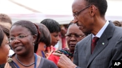 FILE - Rwandan President Paul Kagame meets with participants at a conference on the role of women at the nation's parliament, in Kigali, May 2010.