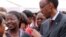 FILE - Rwandan President Paul Kagame meets with participants at a conference on the role of women at the nation's parliament, in Kigali, May 2010.
