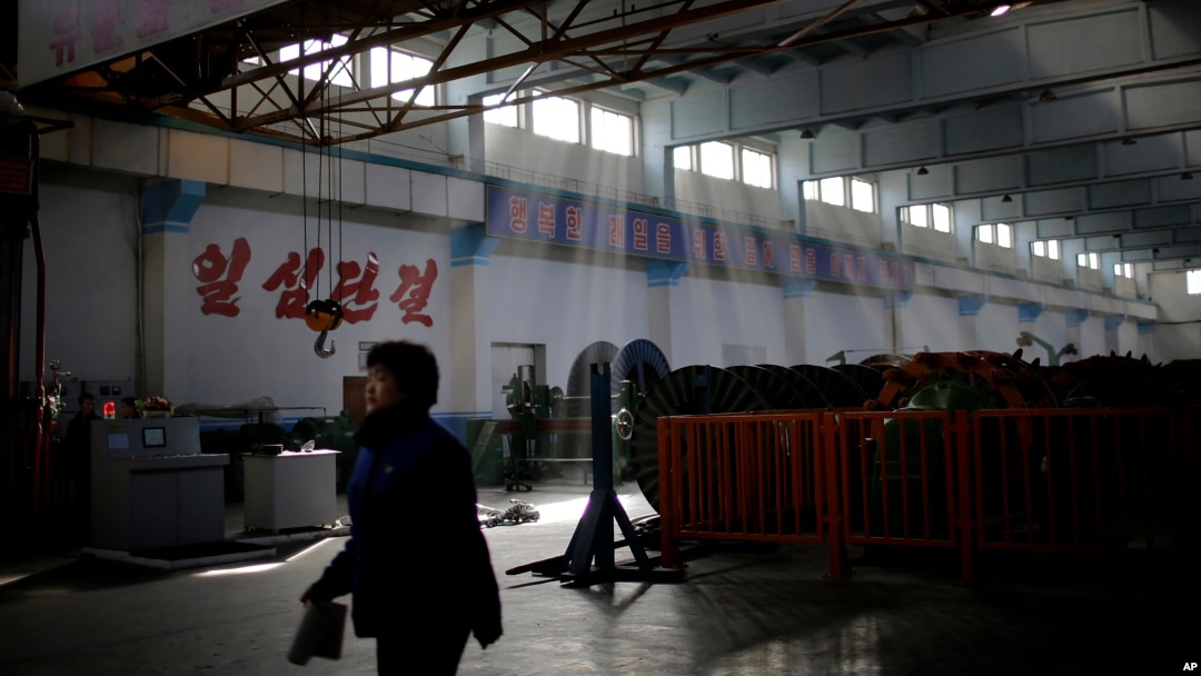FILE - A North Korean factory worker walks through a processing hall at the Pyongyang 326 Electric Wire Factory, in Pyongyang, North Korea, Jan. 10, 2017. Some 30 African countries maintain economic ties with Pyongyang, despite global condemnation of its regime.