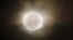 The moon slides across the sun, showing a blazing halo of light, during an annular eclipse at a waterfront park in Yokohama, near Tokyo, May 21, 2012.