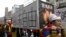 Activists carrying mock-ups of coffins to mourn for those who killed themselves in self-immolation, take part in a rally to commemorate the uprising in Lhasa 53 years ago against Chinese rule, March 10, 2012. 