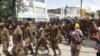 Ethiopian government soldiers and prisoners of war in military uniforms walk through the streets of Mekelle, the capital of Tigray region, Ethiopia, July 2, 2021. 