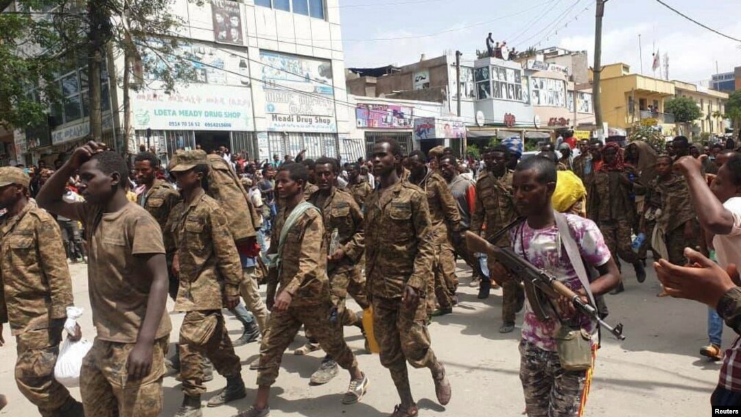 Ethiopian government soldiers and prisoners of war in military uniforms walk through the streets of Mekelle, the capital of Tigray region, Ethiopia, July 2, 2021. 