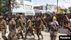 Ethiopian government soldiers and prisoners of war in military uniforms walk through the streets of Mekelle, the capital of Tigray region, Ethiopia, July 2, 2021. 