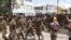 Ethiopian government soldiers and prisoners of war in military uniforms walk through the streets of Mekelle, the capital of Tigray region, Ethiopia, July 2, 2021. 