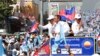 Opposition party Cambodia National Rescue Party (CNRP) President Kem Sokha greets his supporters from a truck as he leads a rally during the last day of campaigning ahead of communal elections in Phnom Penh, Cambodia, Friday, June 2, 2017. Cambodia's longtime ruler Hun Sen warned opposition parties Friday not to challenge the result of Sunday's local elections or they could be dissolved. (AP Photo/Heng Sinith)