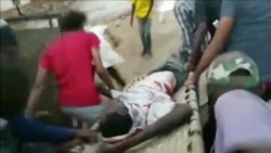 FILE - An injured man is carried on a stretcher during protests in Khartoum, Sudan, June 3, 2019 in this image taken from a video obtained from social media.