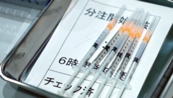 FILE - Syringes with the Moderna vaccine against COVID-19 disease for Tokyo Metropolitan Government employees are seen at a newly opened vaccination center at the government building, Japan, July 1. 2021.