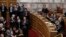 Greece's Prime Minister Antonis Samaras (R) and lawmakers of the government applaud after the second of three rounds of a presidential vote at the Greek parliament in Athens, Dec. 23, 2014. 