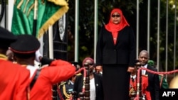 New Tanzanian President Samia Suluhu Hassan, inspects a military parade following her swearing in the country's first female President after the sudden death of President John Magufuli at statehouse in Dar es Salaam, Tanzania on March 19, 2021.