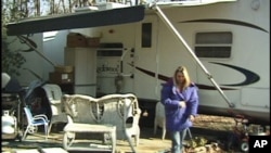 Tammy Renault, her husband and four of their five sons now live in a donated travel-trailer.