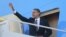 US President Barack Obama steps aboard Air Force One at Andrews Air Force Base near Washington, DC, November 17, 2012.