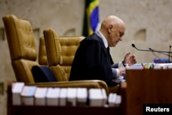 FILE - Judge Alexandre de Moraes speaks during session of a trial for the storming of government buildings in the capital on Jan. 8, 2023, at the Supreme Court in Brasilia, Brazil, on Sept. 14, 2023.