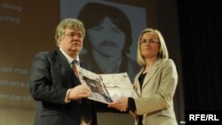 Stefica Galic (right) receives an award for bravery on behalf of her late husband, Nedeljko Galic, in Sarajevo in April.