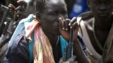 Rebel fighters listen to their commander in rebel-controlled territory in Upper Nile State, Feb. 15, 2014. Fresh fighting broke out there on Thursday, March 5, 2015.