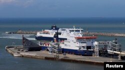 FILE - Cross-Channel ferries are seen in the port of Calais, France, June 24, 2016.