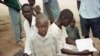 FILE - Sudanese boys pass the time in the Kakuma camp, in northern Kenya, April 24, 2000. Over 20,000 boys who were displaced or orphaned during two decades of civil war endured many hardships as they traveled on foot to refugee camps in Ethiopia and Kenya.