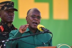 FILE - Tanzania's incumbent President and presidential candidate of ruling party Chama Cha Mapinduzi John Magufuli speaks at the Jamhuri stadium in Dodoma, Tanzania, Aug. 29, 2020.