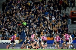 Spectators watch the Super Rugby Aotearoa rugby game between the Highlanders and Chiefs in Dunedin, New Zealand, June 13, 2020.