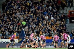 Spectators watch the Super Rugby Aotearoa rugby game between the Highlanders and Chiefs in Dunedin, New Zealand, June 13, 2020.