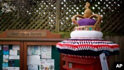 A view of a crocheted crown made as a post box topper by a member of the 'Hurst Hookers' knitting group during a pre-coronation 'yarn bombing', in the village of Hurst, near Reading, England, April 21, 2023.