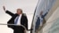 U.S. President Donald Trump waves goodbye as he enters Air Force One in Manila, Philippines, Nov. 14, 2017.