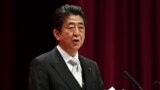 Japan's Prime Minister Shinzo Abe delivers a speech during the graduation ceremony of the National Defense Academy in Yokosuka, Kanagawa prefecture, Japan, March 18, 2018.