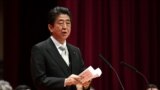 Japan's Prime Minister Shinzo Abe delivers a speech during the graduation ceremony of the National Defense Academy in Yokosuka, Kanagawa prefecture, Japan, March 18, 2018.