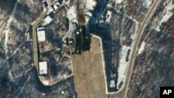 This satellite image provided by DigitalGlobe shows the Sohae Satellite Launching Station in Tongchang-ri, North Korea, 54 minutes after a long-range Unha-3 rocket was successfully launched, Wednesday, Dec. 12, 2012. 