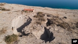 FILE - An aerial view shows sinkholes in the abandoned tourist resort of Ein Gedi on the Dead Sea shore, Nov. 28, 2017. Israel is heading into its fifth consecutive year of drought, putting three celebrated biblical bodies of water at risk.