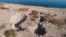 FILE - An aerial view shows sinkholes in the abandoned tourist resort of Ein Gedi on the Dead Sea shore, Nov. 28, 2017. Israel is heading into its fifth consecutive year of drought, putting three celebrated biblical bodies of water at risk.