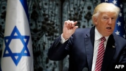 US President Donald Trump gestures during a press conference with Israel's President at the President's Residence in Jerusalem, May 22, 2017. 